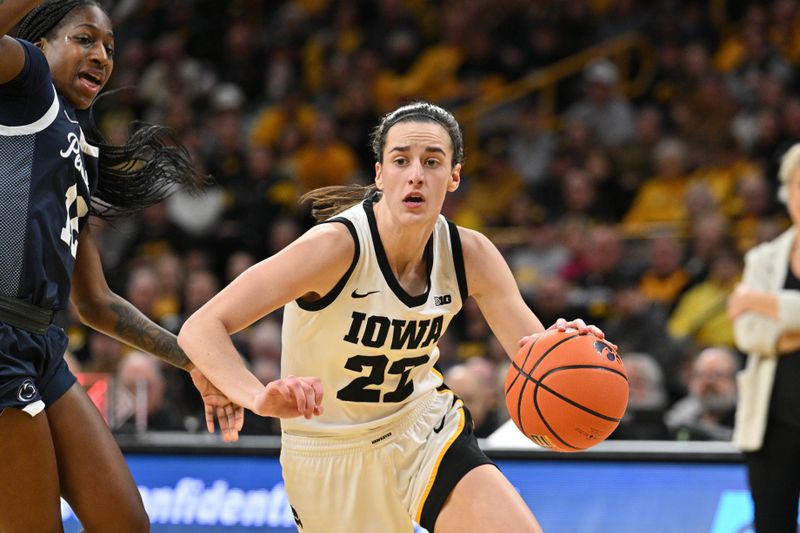 Feb 8, 2024; Iowa City, Iowa, USA; Iowa Hawkeyes guard Caitlin Clark (22) controls the ball as Penn State Nittany Lions guard Jayla Oden (12) defends during the second half at Carver Hawkeye Arena. Mandatory Credit: Jeffrey Becker-USA TODAY Sports