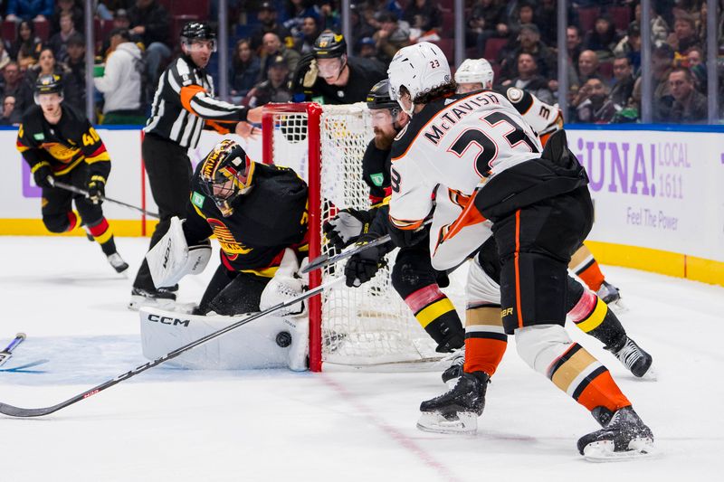 Nov 28, 2023; Vancouver, British Columbia, CAN; Vancouver Canucks goalie Thatcher Demko (35) makes a save on Anaheim Ducks forward Mason McTavish (23) in the third period at Rogers Arena. Vancouver won 3-1. Mandatory Credit: Bob Frid-USA TODAY Sports