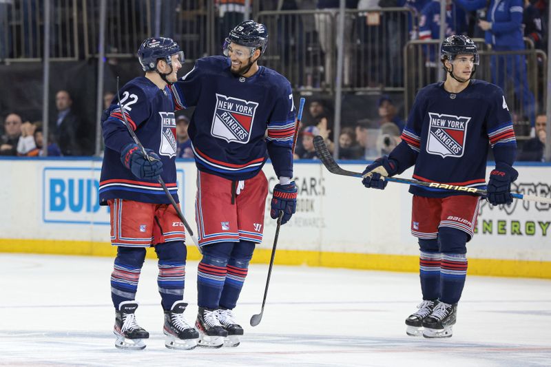 Mar 17, 2024; New York, New York, USA; New York Rangers center Jonny Brodzinski (22) celebrates his goal against the New York Islanders goaltender Ilya Sorokin (30) with defenseman K'Andre Miller (79) during the second period at Madison Square Garden. Mandatory Credit: Vincent Carchietta-USA TODAY Sports