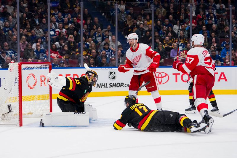 Feb 15, 2024; Vancouver, British Columbia, CAN; Detroit Red Wings forward Christian Fischer (36) and forward J.T. Compher (37) celebrate Compher   s goal as Vancouver Canucks goalie Thatcher Demko (35) and defenseman Filip Hronek (17) look on in the second period at Rogers Arena. Mandatory Credit: Bob Frid-USA TODAY Sports