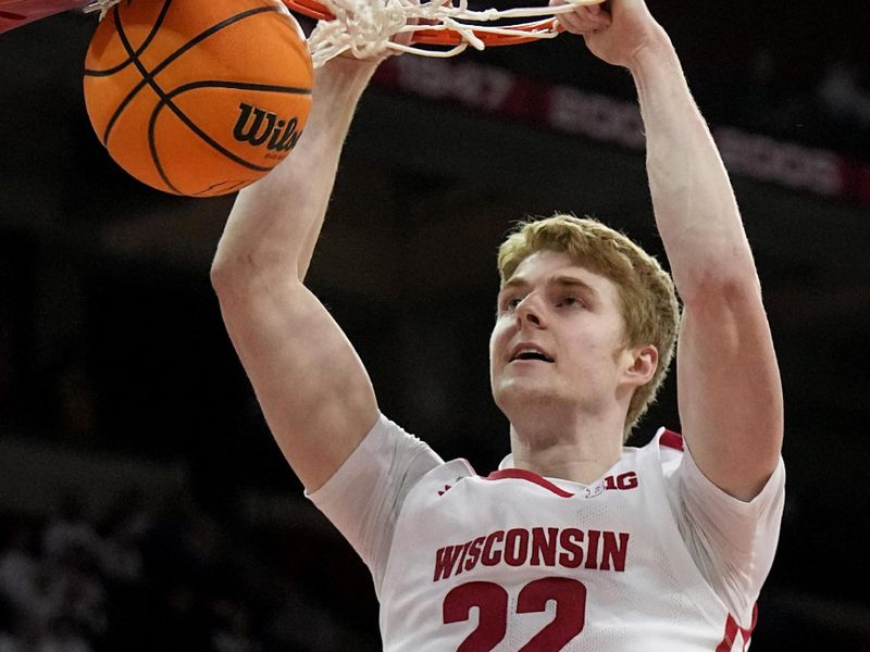 Feb 22, 2023; Madison, Wisconsin, USA; Wisconsin forward Steven Crowl (22) dunks the ball against Iowa during the second half at Kohl Center. Mandatory Credit: Mark Hoffman-USA TODAY Sports