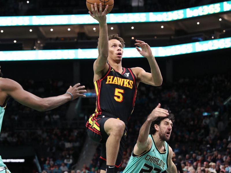 CHARLOTTE, NC - NOVEMBER 30: Dyson Daniels #5 of the Atlanta Hawks drives to the basket during the game against the Charlotte Hornets on November 30, 2024 at Spectrum Center in Charlotte, North Carolina. NOTE TO USER: User expressly acknowledges and agrees that, by downloading and or using this photograph, User is consenting to the terms and conditions of the Getty Images License Agreement. Mandatory Copyright Notice: Copyright 2024 NBAE (Photo by Brock Williams-Smith/NBAE via Getty Images)