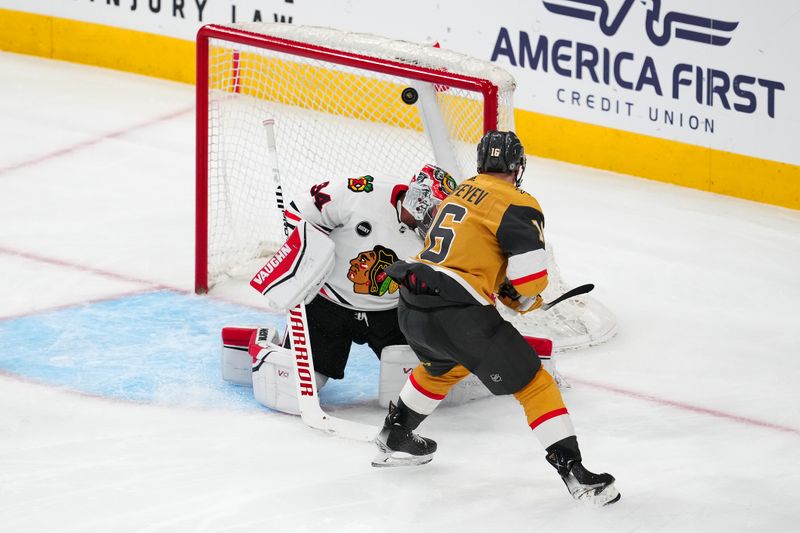 Apr 16, 2024; Las Vegas, Nevada, USA; Vegas Golden Knights left wing Pavel Dorofeyev (16) hits the crossbar behind Chicago Blackhawks goaltender Petr Mrazek (34) during the third period at T-Mobile Arena. Mandatory Credit: Stephen R. Sylvanie-USA TODAY Sports