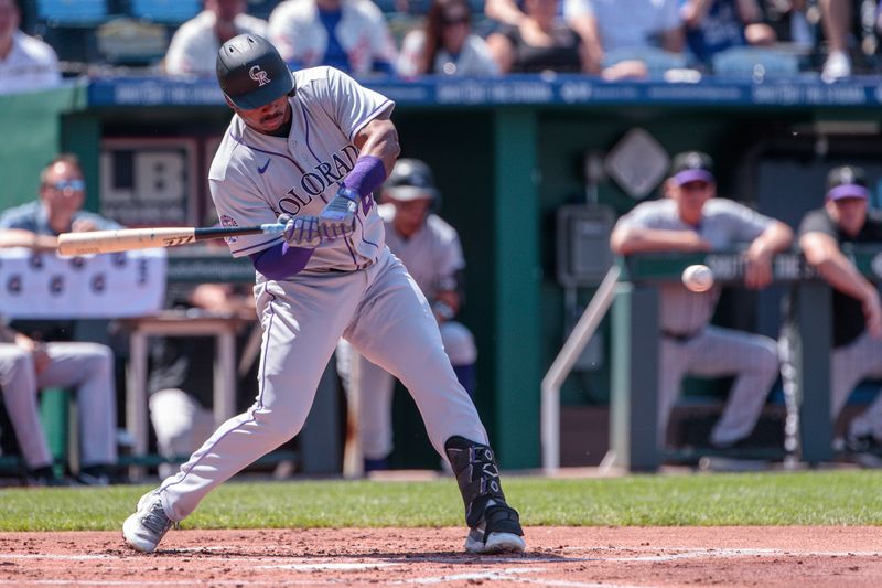 Jun 3, 2023; Kansas City, Missouri, USA; Colorado Rockies third baseman Elehuris Montero (44) hits a triple during the first inning against the Kansas City Royals at Kauffman Stadium. Mandatory Credit: William Purnell-USA TODAY Sports