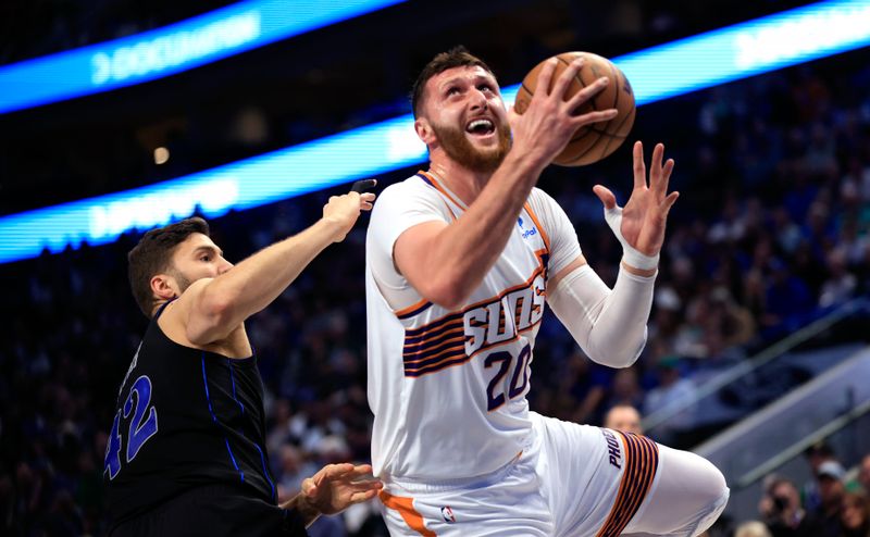 DALLAS, TX - FEBRUARY 22: Jusuf Nurkic #20 of the Phoenix Suns goes up for a shot as Maxi Kleber #42 of the Dallas Mavericks pressures in the first half at American Airlines Center on February 22, 2024 in Dallas, Texas. NOTE TO USER: User expressly acknowledges and agrees that, by downloading and or using this photograph, User is consenting to the terms and conditions of the Getty Images License Agreement. (Photo by Ron Jenkins/Getty Images)