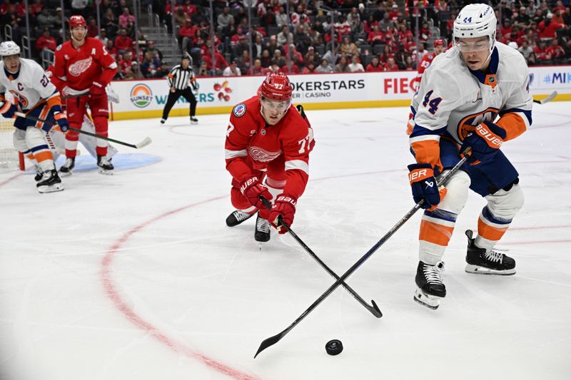 Nov 21, 2024; Detroit, Michigan, USA;  New York Islanders center Jean-Gabriel Pageau (44) battles for control of the puck with Detroit Red Wings defenseman Simon Edvinsson (77) in the first period at Little Caesars Arena. Mandatory Credit: Lon Horwedel-Imagn Images