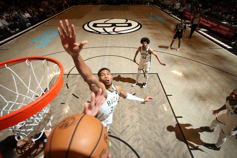 BROOKLYN, NY - DECEMBER 8: Giannis Antetokounmpo #34 of the Milwaukee Bucks attempts a block during the game against the Brooklyn Nets on December 8, 2024 at Barclays Center in Brooklyn, New York. NOTE TO USER: User expressly acknowledges and agrees that, by downloading and or using this Photograph, user is consenting to the terms and conditions of the Getty Images License Agreement. Mandatory Copyright Notice: Copyright 2024 NBAE (Photo by Nathaniel S. Butler/NBAE via Getty Images)