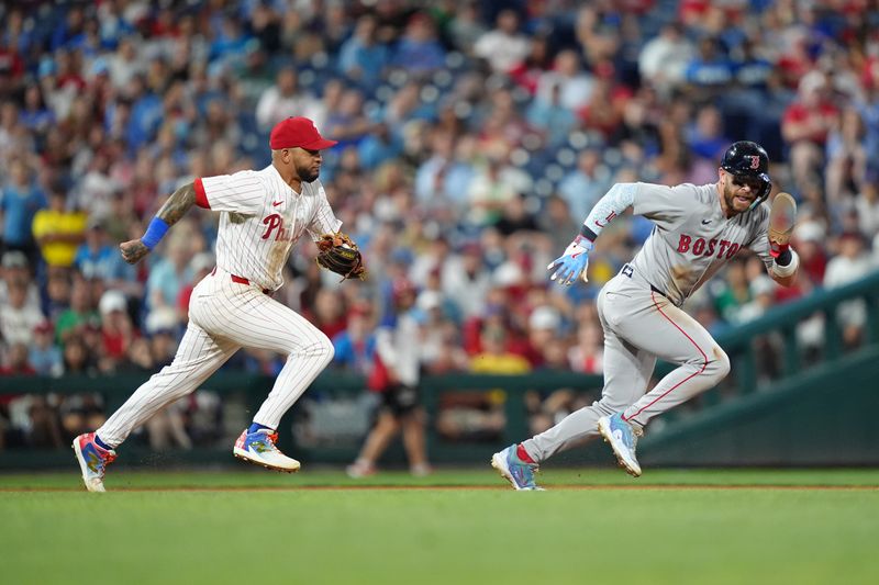 Jul 23, 2025; Philadelphia, Pennsylvania, USA; Philadelphia Phillies infielder Edmundo Sosa (33) runs down Boston Red Sox infielder Trevor Story (10) in the tenth inning at Citizens Bank Park. Mandatory Credit: Kyle Ross-Imagn Images