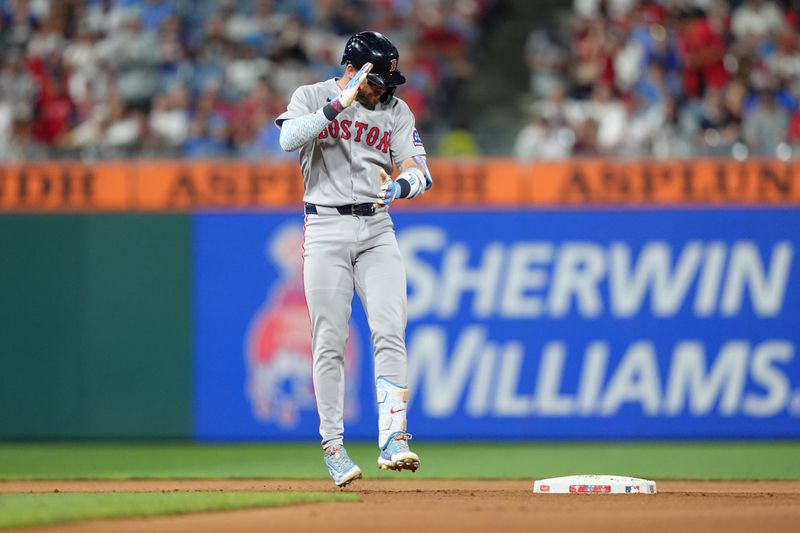 Jul 23, 2025; Philadelphia, Pennsylvania, USA; Boston Red Sox infielder Trevor Story (10) reacts after hitting an RBI double against the Philadelphia Phillies in the tenth inning at Citizens Bank Park. Mandatory Credit: Kyle Ross-Imagn Images
