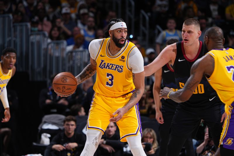 DENVER, CO - APRRIL 22: Anthony Davis #3 of the Los Angeles Lakers looks to pass the ball during the game against the Denver Nuggets during Round 1 Game 2 of the 2024 NBA Playoffs on April 22, 2024 at the Ball Arena in Denver, Colorado. NOTE TO USER: User expressly acknowledges and agrees that, by downloading and/or using this Photograph, user is consenting to the terms and conditions of the Getty Images License Agreement. Mandatory Copyright Notice: Copyright 2024 NBAE (Photo by Garrett Ellwood/NBAE via Getty Images)