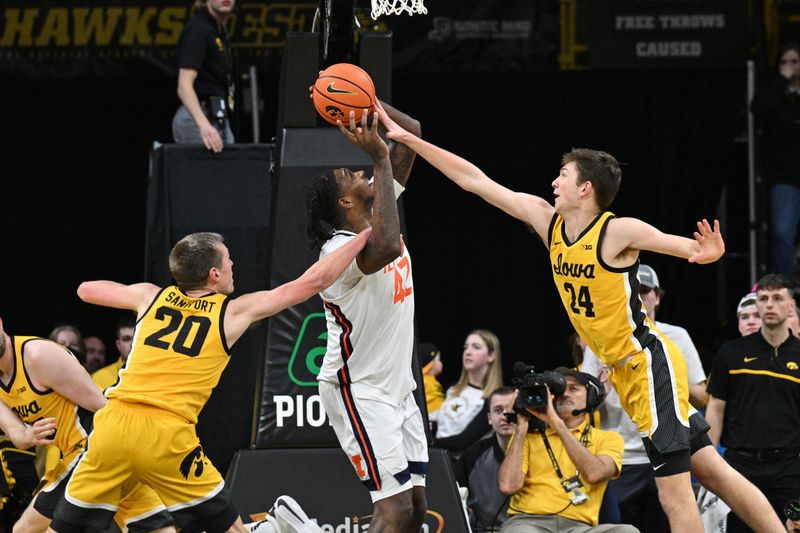 Mar 10, 2024; Iowa City, Iowa, USA; Iowa Hawkeyes forward Payton Sandfort (20) fouls Illinois Fighting Illini forward Dain Dainja (42) as forward Pryce Sandfort (24) defends during the second half at Carver-Hawkeye Arena. Mandatory Credit: Jeffrey Becker-USA TODAY Sports