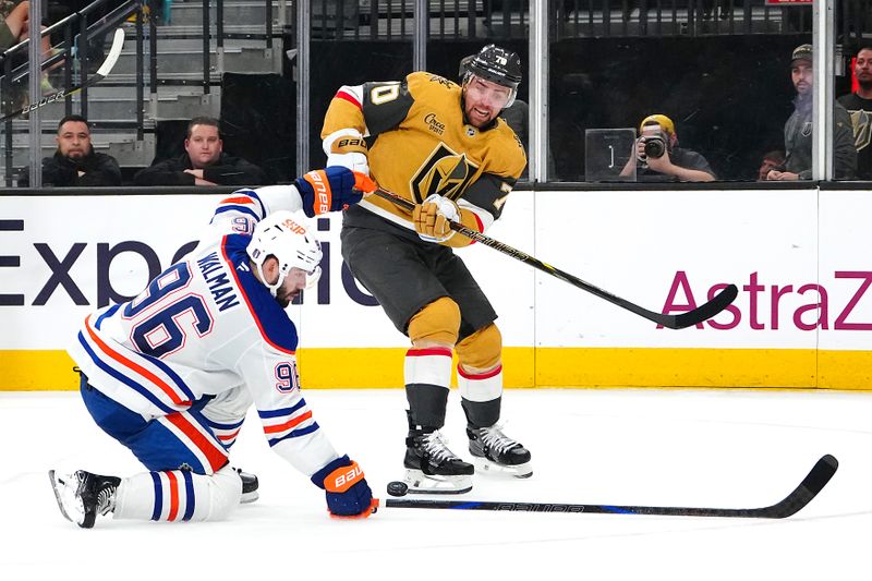 May 6, 2025; Las Vegas, Nevada, USA; Edmonton Oilers defenseman Jake Walman (96) blocks a centering pass attempt by Vegas Golden Knights left wing Tanner Pearson (70) during the second period of game one of the second round of the 2025 Stanley Cup Playoffs at T-Mobile Arena. Mandatory Credit: Stephen R. Sylvanie-Imagn Images