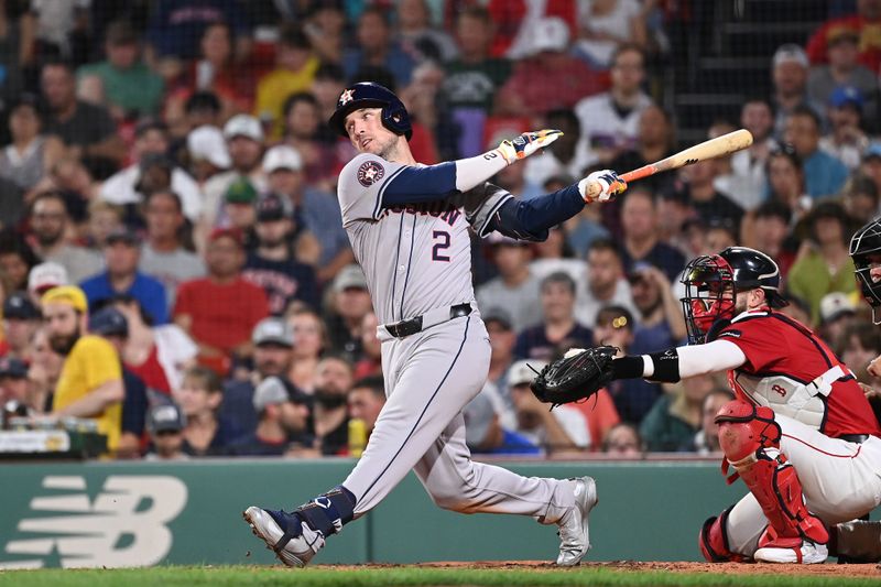 Aug 9, 2024; Boston, Massachusetts, USA; Houston Astros third baseman Alex Bregman (2) hits a single against the Boston Red Sox during the fifth inning at Fenway Park. Mandatory Credit: Eric Canha-USA TODAY Sports