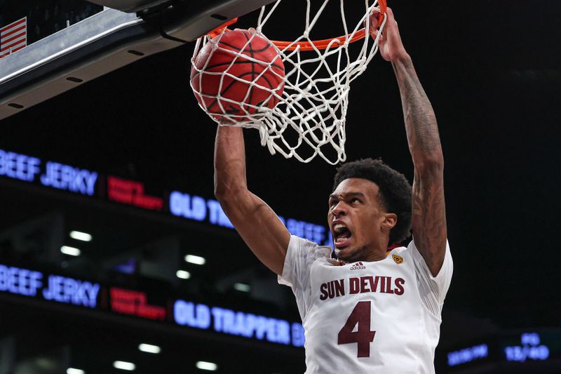 Nov 17, 2022; Brooklyn, New York, USA; Arizona State Sun Devils guard Desmond Cambridge Jr. (4) dunks the ball during the second half against the Michigan Wolverines at Barclays Center. Mandatory Credit: Vincent Carchietta-USA TODAY Sports