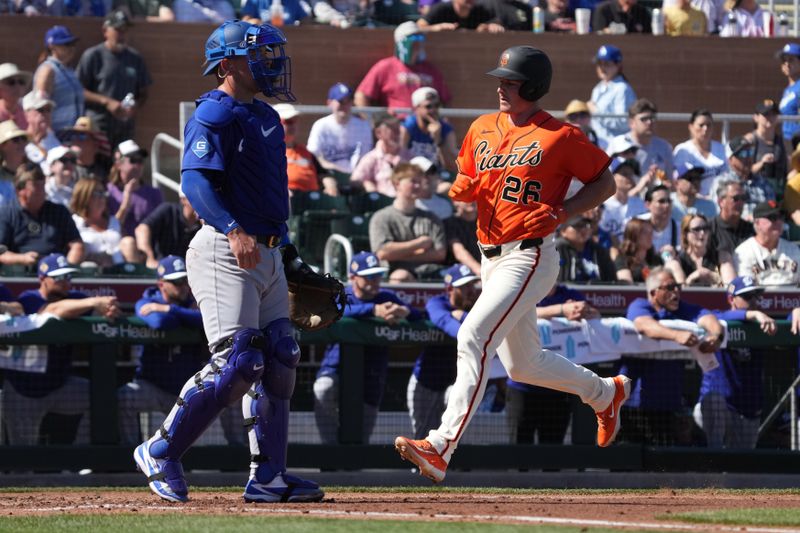 Feb 27, 2026; Scottsdale, Arizona, USA; San Francisco Giants third baseman Matt Chapman (26) scores run against the Los Angeles Dodgers in the second inning at Scottsdale Stadium. Mandatory Credit: Rick Scuteri-Imagn Images