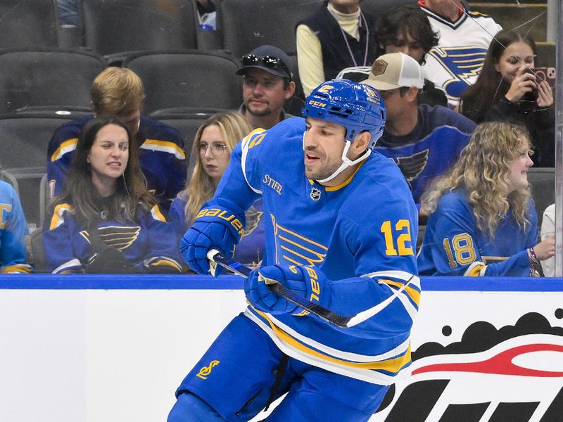 Oct 2, 2025; St. Louis, Missouri, USA; St. Louis Blues left wing Milan Lucic (12) skates against the Ottawa Senators during the second period at Enterprise Center. Mandatory Credit: Jeff Curry-Imagn Images