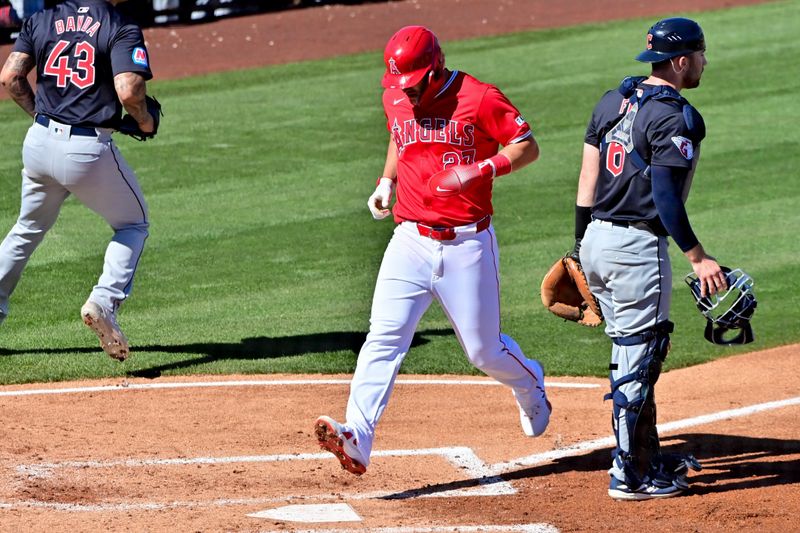 Feb 29, 2024; Tempe, Arizona, USA;  Los Angeles Angels center fielder Mike Trout (27) scores in the fourth inning against the Cleveland Guardians during a spring training game at Tempe Diablo Stadium. Mandatory Credit: Matt Kartozian-USA TODAY Sports