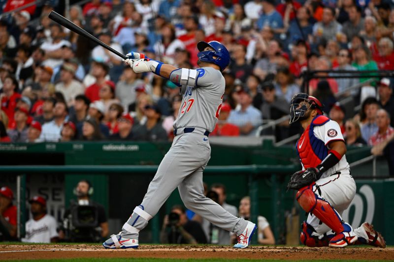 Jun 3, 2025; Washington, District of Columbia, USA; Chicago Cubs right fielder Seiya Suzuki (27) hits a RBI sacrifice fly against the Washington Nationals during the fifth inning at Nationals Park. Mandatory Credit: Brad Mills-Imagn Images