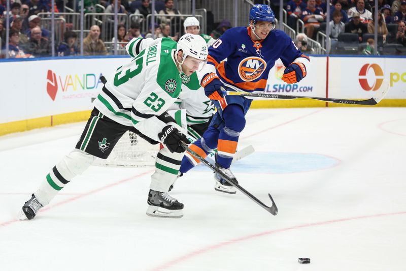 Mar 26, 2026; Elmont, New York, USA; Dallas Stars defenseman Esa Lindell (23) and New York Islanders center Brayden Schenn (10) chase the puck in the second period at UBS Arena. Mandatory Credit: Wendell Cruz-Imagn Images Mar 26, 2026; Elmont, New York, USA; Dallas Stars defenseman Esa Lindell (23) and New York Islanders center Brayden Schenn (10) chase the puck in the second period at UBS Arena. Mandatory Credit: Wendell Cruz-Imagn Images