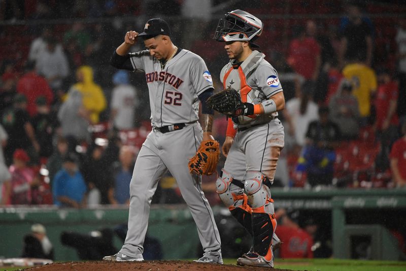 Aug 29, 2023; Boston, Massachusetts, USA;  Houston Astros relief pitcher Bryan Abreu (52) and catcher Yainer Diaz (21) react after defeating the Boston Red Sox at Fenway Park. Mandatory Credit: Bob DeChiara-USA TODAY Sports