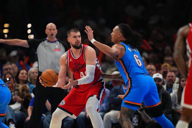 OKLAHOMA CITY, OK - JANUARY 2: Ivica Zubac #40 of the LA Clippers handles the ball during the game against the Oklahoma City Thunder on January 2, 2025 at Paycom Center in Oklahoma City, Oklahoma. NOTE TO USER: User expressly acknowledges and agrees that, by downloading and or using this photograph, User is consenting to the terms and conditions of the Getty Images License Agreement. Mandatory Copyright Notice: Copyright 2025 NBAE (Photo by Cooper Neill/NBAE via Getty Images)