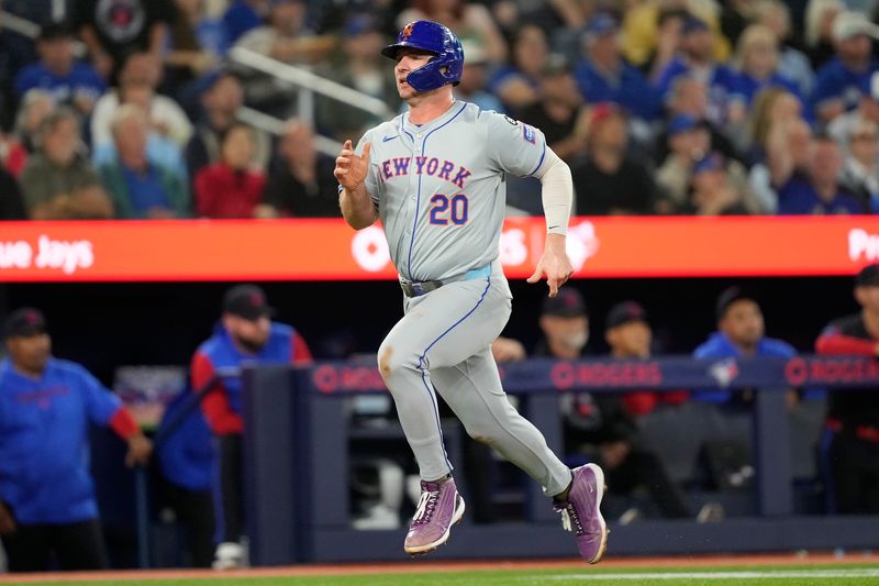 Sep 9, 2024; Toronto, Ontario, CAN; New York Mets first baseman Pete Alonso (20) scores on a single by designated hitter J.D. Martinez (not pictured) against the Toronto Blue Jays during the fourth inning at Rogers Centre. Mandatory Credit: John E. Sokolowski-Imagn Images