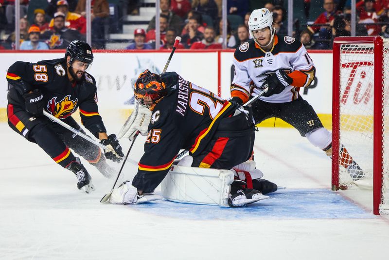 Apr 2, 2024; Calgary, Alberta, CAN; Calgary Flames goaltender Jacob Markstrom (25) makes a save against Anaheim Ducks right wing Troy Terry (19) during the second period at Scotiabank Saddledome. Mandatory Credit: Sergei Belski-USA TODAY Sports