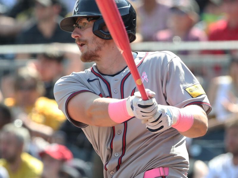May 11, 2025; Pittsburgh, Pennsylvania, USA;  Atlanta Braves pinch hitter Sean Murphy (12) hits a three run double against the Pittsburgh Pirates during the eighth inning at PNC Park. Mandatory Credit: Charles LeClaire-Imagn Images