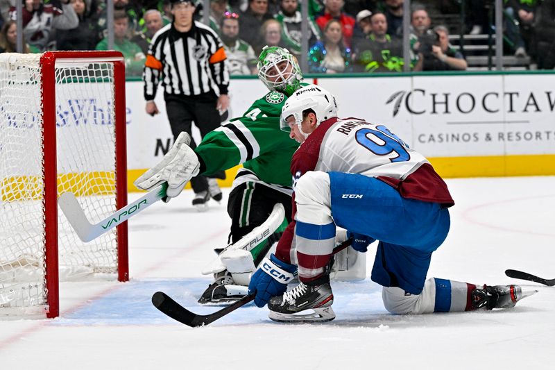 Jan 4, 2024; Dallas, Texas, USA; Dallas Stars goaltender Scott Wedgewood (41) stops a shot by Colorado Avalanche right wing Mikko Rantanen (96) during the first period at the American Airlines Center. Mandatory Credit: Jerome Miron-USA TODAY Sports