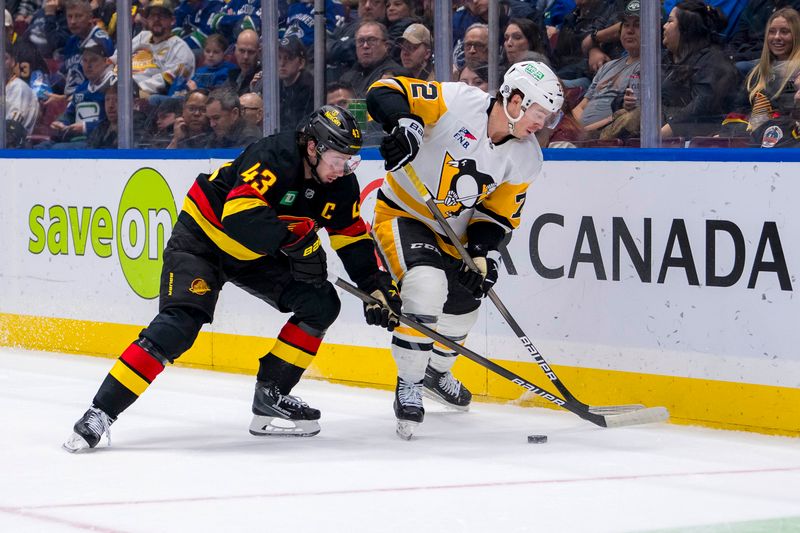 Oct 26, 2024; Vancouver, British Columbia, CAN; Vancouver Canucks defenseman Quinn Hughes (43) stick checks Pittsburgh Penguins forward Anthony Beauvillier (72) during the second period at Rogers Arena. Mandatory Credit: Bob Frid-Imagn Images