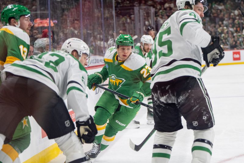 Nov 16, 2024; Saint Paul, Minnesota, USA; Minnesota Wild center Marco Rossi (23) skates after a loose puck against Dallas Stars center Matt Duchene (95)  in the first period at Xcel Energy Center. Mandatory Credit: Matt Blewett-Imagn Images