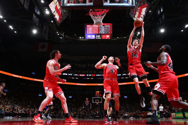 TORONTO, CANADA - JANUARY 31:  Matas Buzelis #14 of Chicago Bulls goes up for the rebound during the game against the Toronto Raptors  on January 31, 2025 at the Scotiabank Arena in Toronto, Ontario, Canada.  NOTE TO USER: User expressly acknowledges and agrees that, by downloading and or using this Photograph, user is consenting to the terms and conditions of the Getty Images License Agreement.  Mandatory Copyright Notice: Copyright 2025 NBAE (Photo by Vaughn Ridley/NBAE via Getty Images)