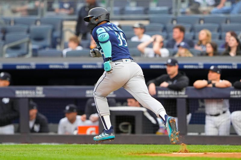 Jun 22, 2023; Bronx, New York, USA; Seattle Mariners right fielder Teoscar Hernandez (35) runs out an RBI single against the New York Yankees during the first inning at Yankee Stadium. Mandatory Credit: Gregory Fisher-USA TODAY Sports