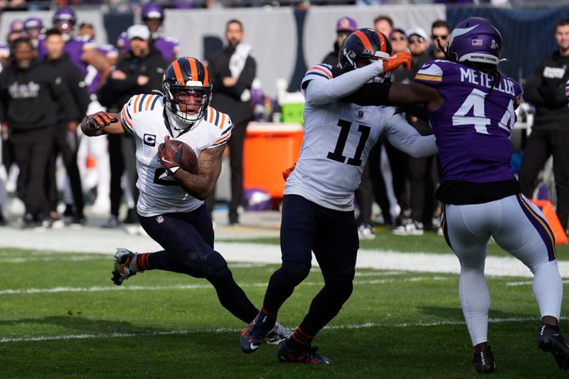 Chicago Bears wide receiver DJ Moore (2) runs after a catch during the first half of an NFL football game against the Minnesota Vikings, Sunday, Nov. 24, 2024, in Chicago. (AP Photo/Charles Rex Arbogast)