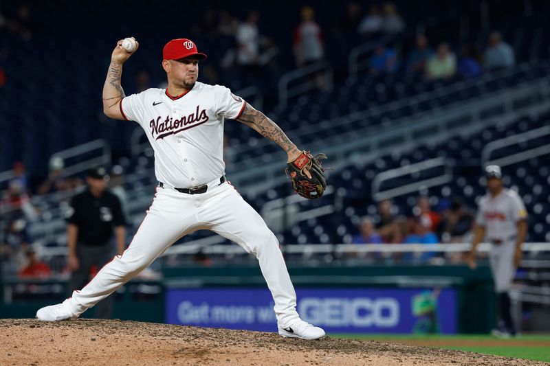 Sep 10, 2024; Washington, District of Columbia, USA; Washington Nationals second baseman Ildemaro Vargas (14) pitches against the Atlanta Braves during the ninth inning at Nationals Park. Mandatory Credit: Geoff Burke-Imagn Images