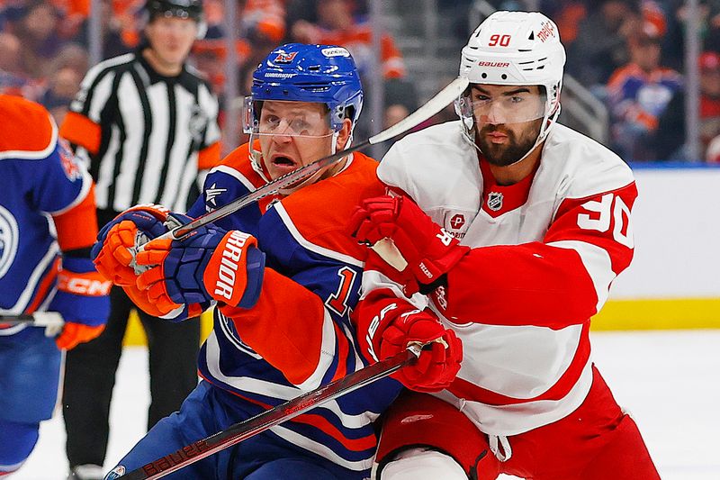 Jan 30, 2025; Edmonton, Alberta, CAN; Edmonton Oilers forward Mattias Janmark (13) and Detroit Red Wings forward Joe Veleno (90) battle for position during the first period at Rogers Place. Mandatory Credit: Perry Nelson-Imagn Images