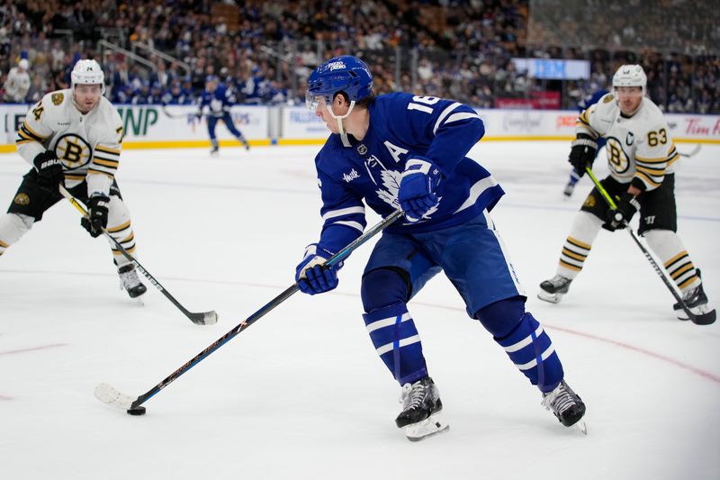 Mar 4, 2024; Toronto, Ontario, CAN; Toronto Maple Leafs forward Mitchell Marner (16) looks to pass the puck as Boston Bruins forward Jake DeBrusk (74) and forward Brad Marchand (63) close in during the third period at Scotiabank Arena. Mandatory Credit: John E. Sokolowski-USA TODAY Sports