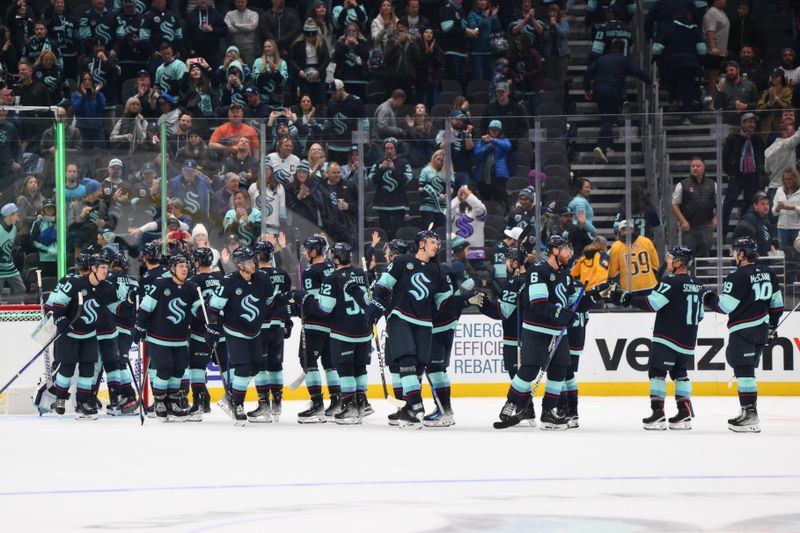 Nov 2, 2023; Seattle, Washington, USA; The Seattle Kraken celebrate defeating the Nashville Predators at Climate Pledge Arena. Mandatory Credit: Steven Bisig-USA TODAY Sports