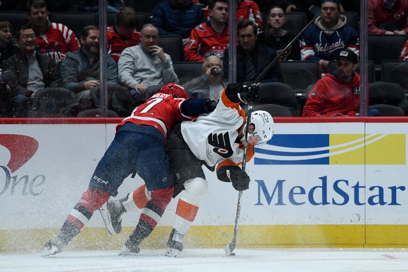 Feb 25, 2026; Washington, District of Columbia, USA; Philadelphia Flyers right wing Matvei Michkov (39) controls the puck defended by Washington Capitals defenseman Martin Fehervary (42) during the second period at Capital One Arena. Mandatory Credit: Hannah Foslien-Imagn Images