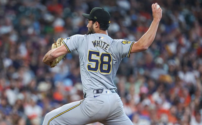 May 19, 2024; Houston, Texas, USA; Milwaukee Brewers relief pitcher Mitch White (58) delivers a pitch during the seventh inning against the Houston Astros at Minute Maid Park. Mandatory Credit: Troy Taormina-USA TODAY Sports