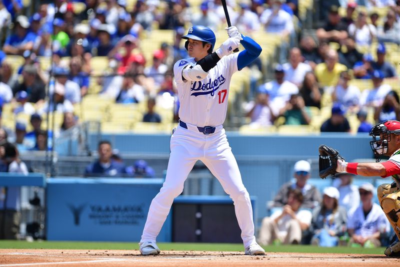 May 19, 2024; Los Angeles, California, USA; Los Angeles Dodgers designated hitter Shohei Ohtani (17) hits against the Cincinnati Reds during the first inning at Dodger Stadium. Mandatory Credit: Gary A. Vasquez-USA TODAY Sports