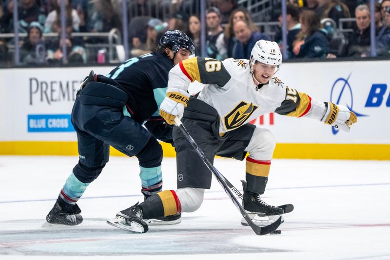 Nov 8, 2024; Seattle, Washington, USA;  Vegas Golden Knights forward Pavel Dorofeyev (16) battles Seattle Kraken forward Brandon Tanev (13) for the puck during the first period at Climate Pledge Arena. Mandatory Credit: Stephen Brashear-Imagn Images