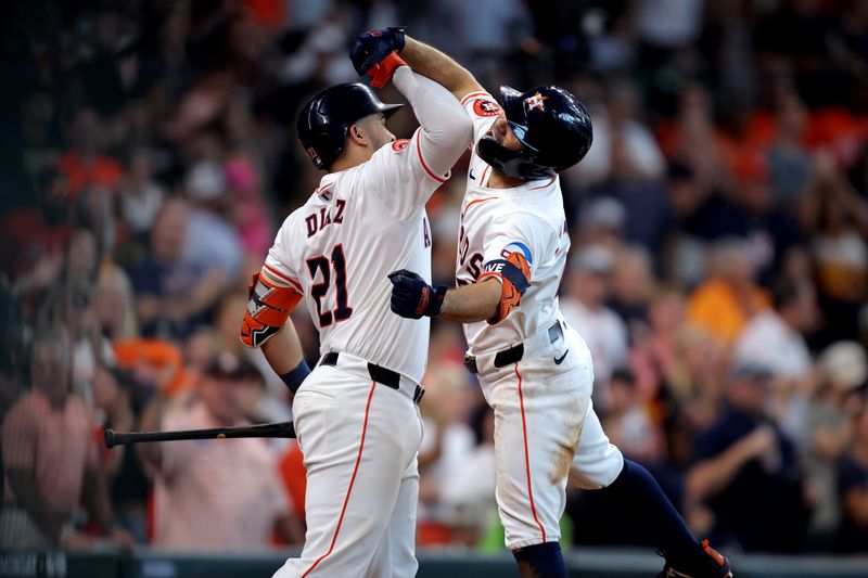 Aug 18, 2024; Houston, Texas, USA; Houston Astros designated hitter Jose Altuve (27) is congratulated by  catcher Yainer Diaz (21) after hitting a home run to left field against the Chicago White Sox during the eighth inning at Minute Maid Park. Mandatory Credit: Erik Williams-USA TODAY Sports