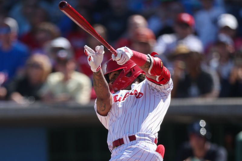 Feb 25, 2024; Clearwater, Florida, USA;  Philadelphia Phillies centerfielder Cristian Pache (19) hits an rbi single against the New York Yankees in the second inning at BayCare Ballpark. Mandatory Credit: Nathan Ray Seebeck-USA TODAY Sports