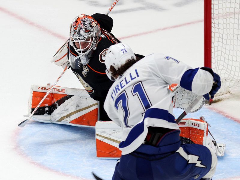 Mar 24, 2024; Anaheim, California, USA; Tampa Bay Lightning center Anthony Cirelli (71) scores the game-winning goal during overtime past Anaheim Ducks goaltender Lukas Dostal (1) at Honda Center. Mandatory Credit: Jason Parkhurst-USA TODAY Sports