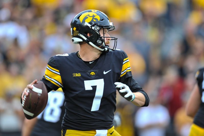 Sep 10, 2022; Iowa City, Iowa, USA; Iowa Hawkeyes quarterback Spencer Petras (7) throws a pass against the Iowa State Cyclones during the second quarter at Kinnick Stadium. Mandatory Credit: Jeffrey Becker-USA TODAY Sports