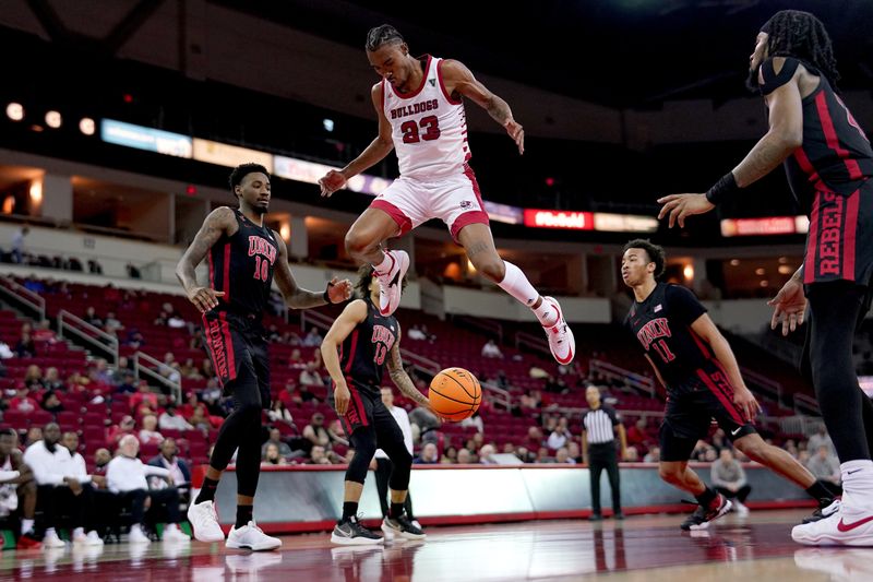 Feb 14, 2024; Fresno, California, USA; Fresno State Bulldogs guard Leo Colimerio (23) has the ball knocked out of his hands by UNLV Rebels guard Dedan Thomas Jr. (11) in the second half at the Save Mart Center. Mandatory Credit: Cary Edmondson-USA TODAY Sports