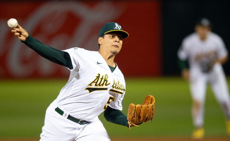 Aug 19, 2023; Oakland, California, USA; Oakland Athletics pitcher Adri  n Mart  nez (55) pitches against the Baltimore Orioles during the 10th inning at Oakland-Alameda County Coliseum. Mandatory Credit: D. Ross Cameron-USA TODAY Sports