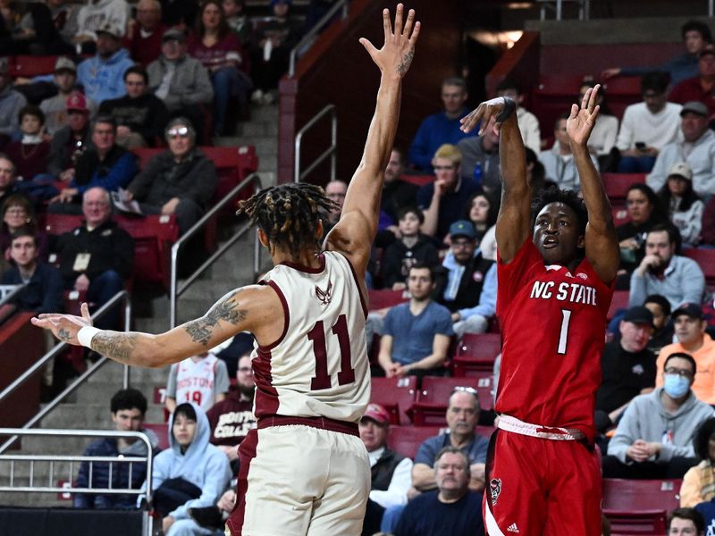 Feb 11, 2023; Chestnut Hill, Massachusetts, USA; North Carolina State Wolfpack guard Jarkel Joiner (1) attempts a three-point basket past Boston College Eagles guard Makai Ashton-Langford (11) during the first half at the Conte Forum. Mandatory Credit: Brian Fluharty-USA TODAY Sports