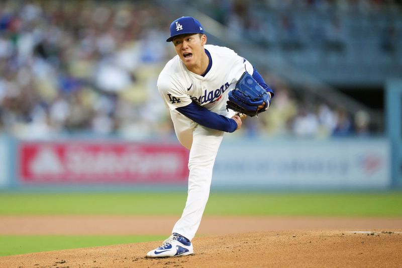 May 7, 2024; Los Angeles, California, USA; Los Angeles Dodgers pitcher Yoshinobu Yamamoto (18) throws in the first inning against the Miami Marlins at Dodger Stadium. Mandatory Credit: Kirby Lee-USA TODAY Sports